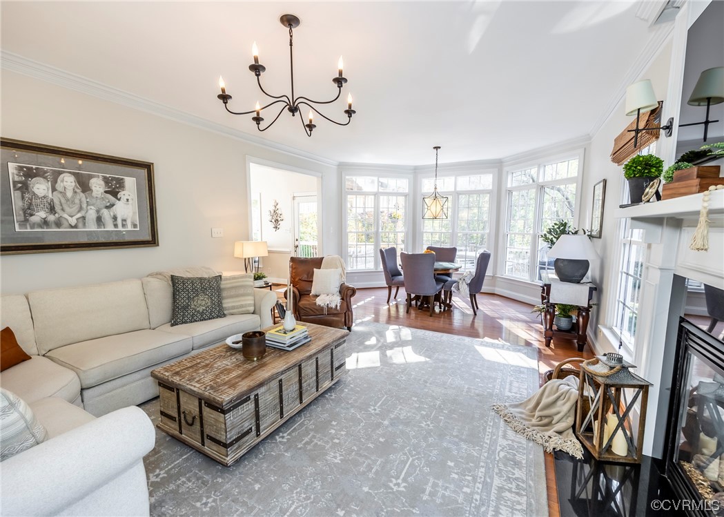 14506 Post Mill Drive Midlothian, VA 23113 - Photo 29 of 48 a living room with fireplace furniture and a chandelier