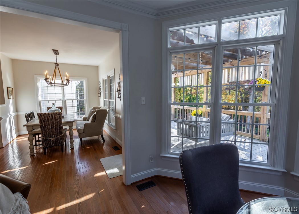 14506 Post Mill Drive Midlothian, VA 23113 - Photo 30 of 48 a view of a dining room with furniture a chandelier and wooden floor