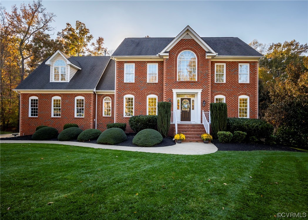 14506 Post Mill Drive Midlothian, VA 23113 - Photo 3 of 48 a front view of a house with a yard and garage