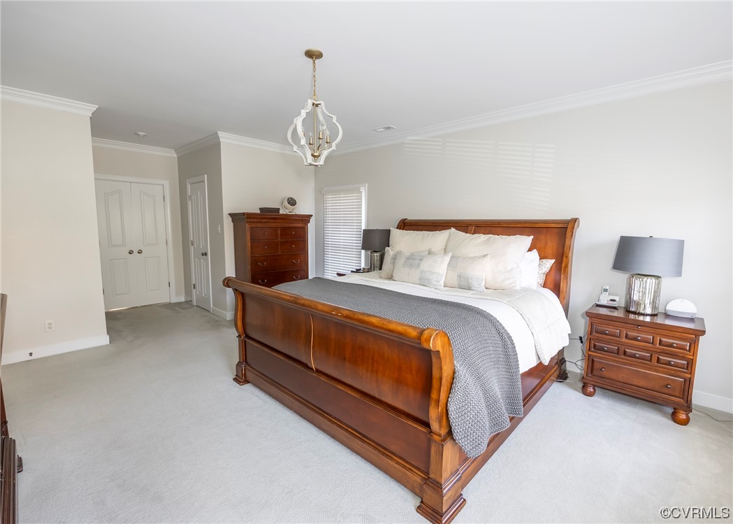 14506 Post Mill Drive Midlothian, VA 23113 - Photo 33 of 48 a spacious bedroom with a bed and a chandelier