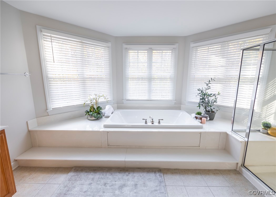 14506 Post Mill Drive Midlothian, VA 23113 - Photo 35 of 48 a white bath tub sitting in a bathroom next to a window
