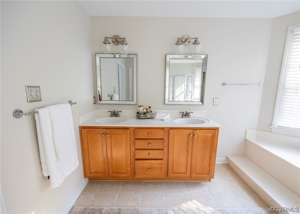 14506 Post Mill Drive Midlothian, VA 23113 - Photo 37 of 48 a bathroom with a double vanity sink a mirror and a bathtub