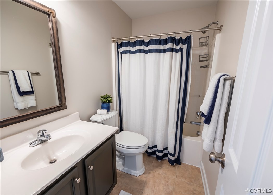 14506 Post Mill Drive Midlothian, VA 23113 - Photo 39 of 48 a bathroom with a sink a mirror a toilet and shower curtain