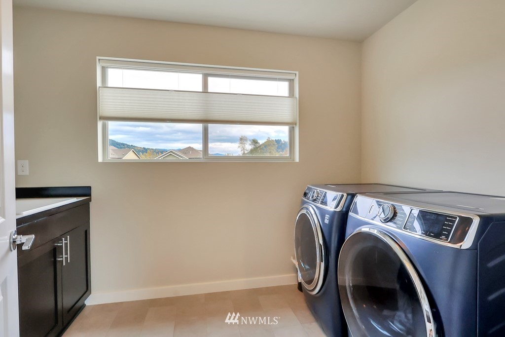 471 Partlon Street Buckley, WA 98321 - Photo 17 of 23 a bathroom with a sink and a mirror