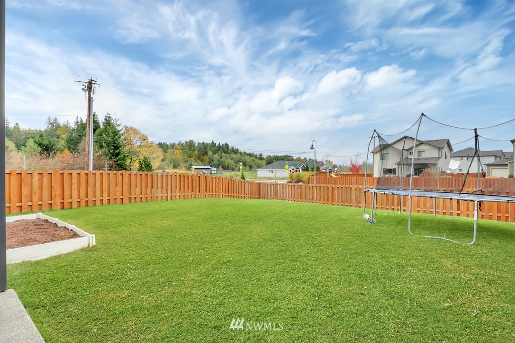 471 Partlon Street Buckley, WA 98321 - Photo 23 of 23 a view of a house with a yard and garage