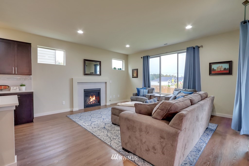 471 Partlon Street Buckley, WA 98321 - Photo 10 of 23 a living room with furniture and a fireplace