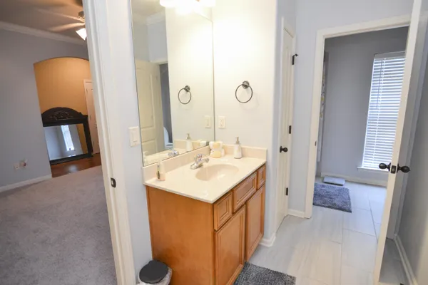 an empty room with a window and mirror
