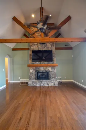 a view of a room with wooden floor