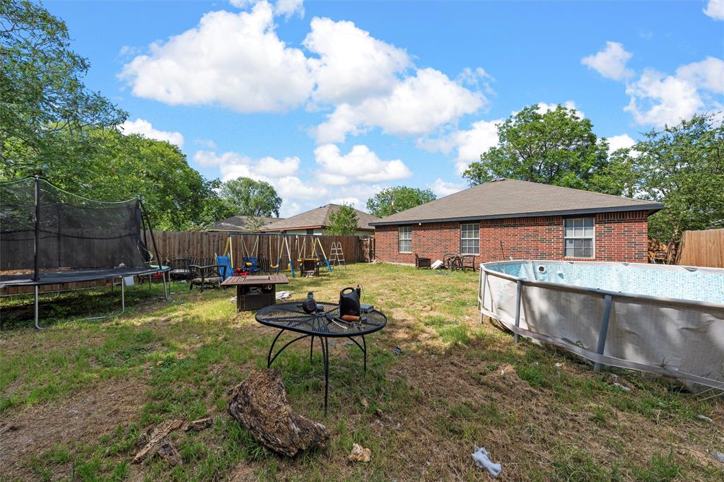 1012 Hatton Street Waco, TX 76704 - Photo 12 of 13 a front view of house with a garden and patio