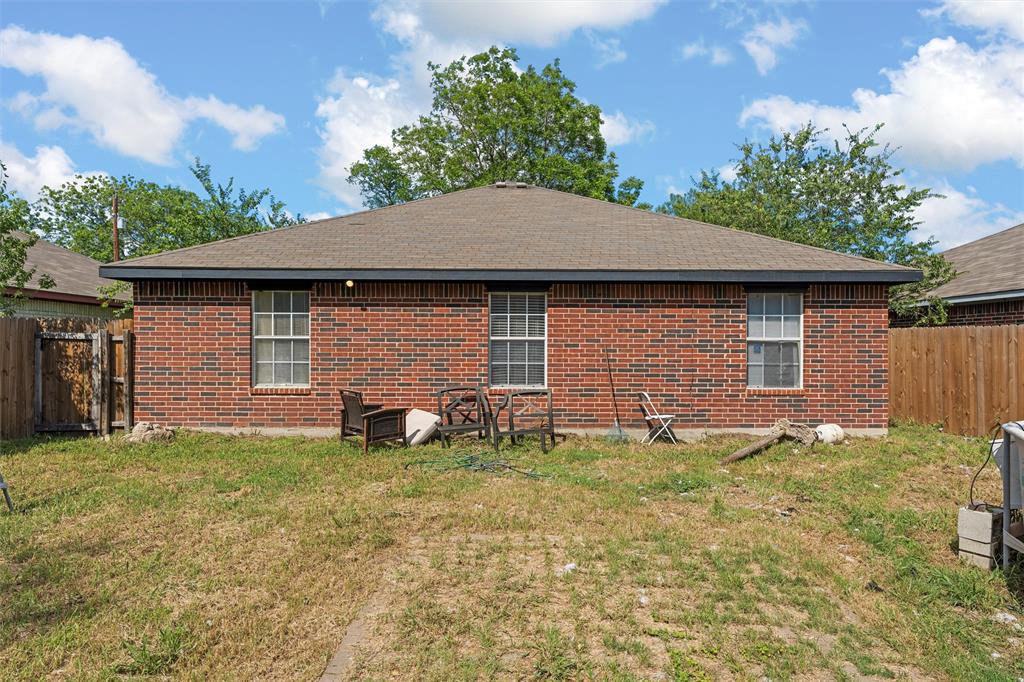 1012 Hatton Street Waco, TX 76704 - Photo 13 of 13 a front view of a house with a yard