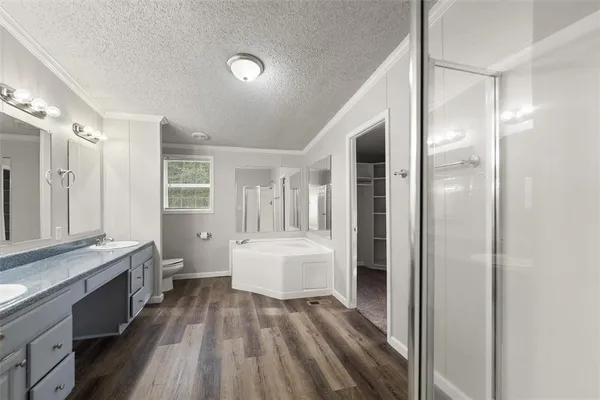a bathroom with a sink a mirror and a bathtub