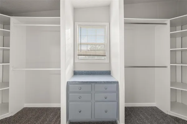 a view of an empty walk in closet