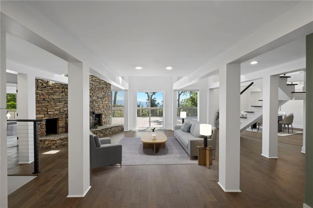 a view of a living room kitchen and a large window