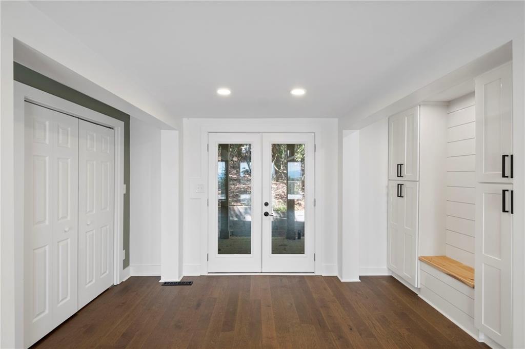 62 Bear Cub Ridge Big Canoe, GA 30143 - Photo 11 of 35 a view of an empty room with wooden floor and a window