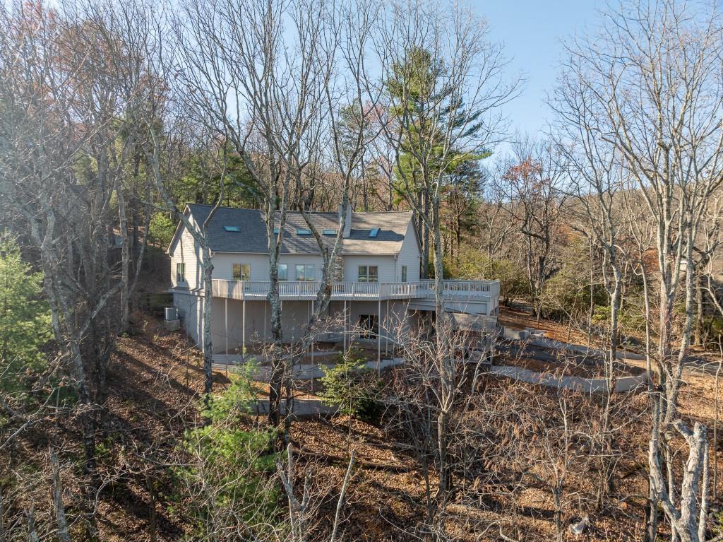 62 Bear Cub Ridge Big Canoe, GA 30143 - Photo 25 of 35 a view of a house with a yard and trees