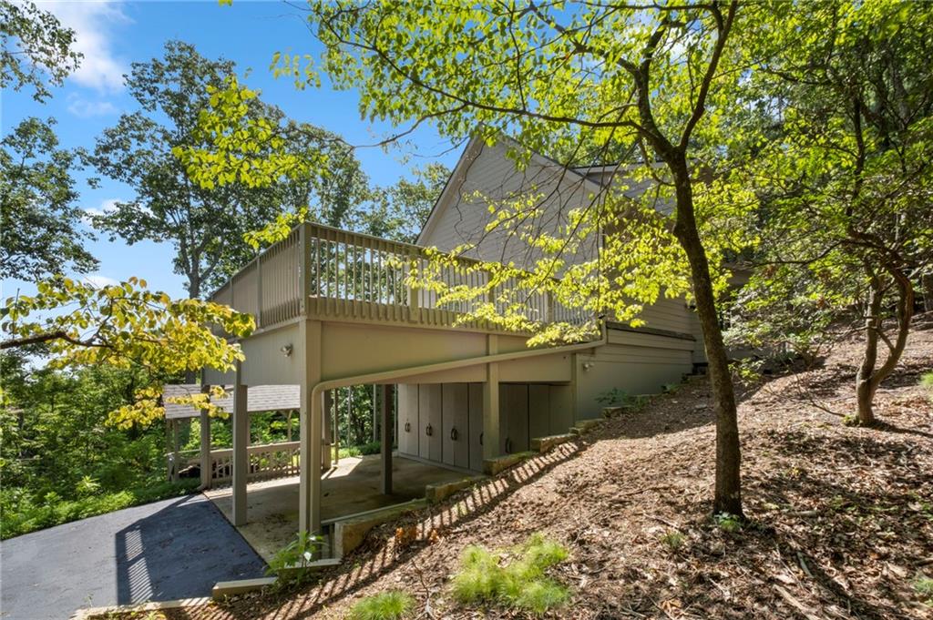 62 Bear Cub Ridge Big Canoe, GA 30143 - Photo 27 of 35 a front view of a house with garden