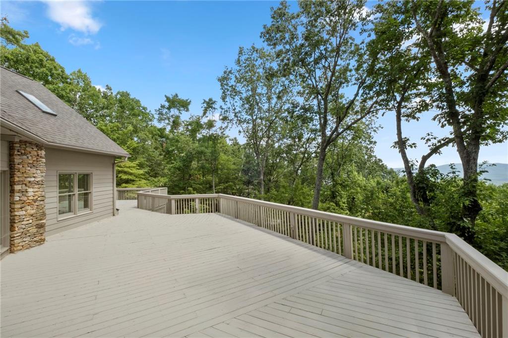 62 Bear Cub Ridge Big Canoe, GA 30143 - Photo 4 of 35 a view of balcony with wooden floor and fence
