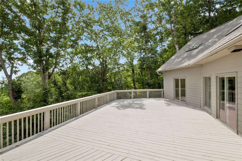 62 Bear Cub Ridge Big Canoe, GA 30143 - Photo 5 of 35 a view of balcony with wooden floor and fence