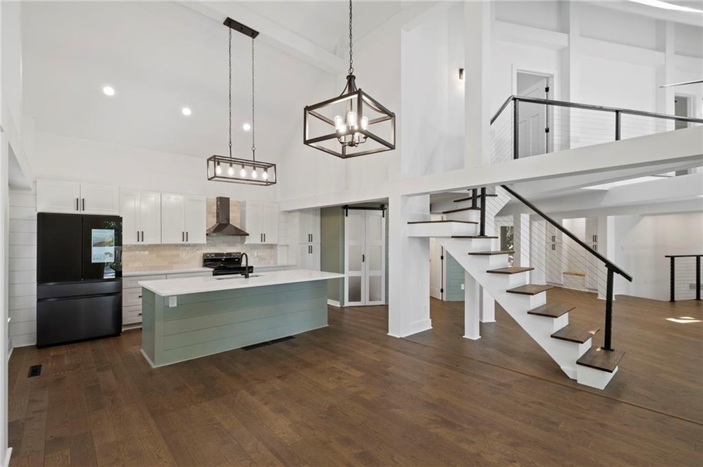 62 Bear Cub Ridge Big Canoe, GA 30143 - Photo 6 of 35 a view of kitchen and sink with wooden floor