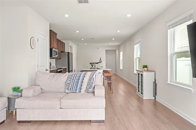 a living room with furniture and a large window