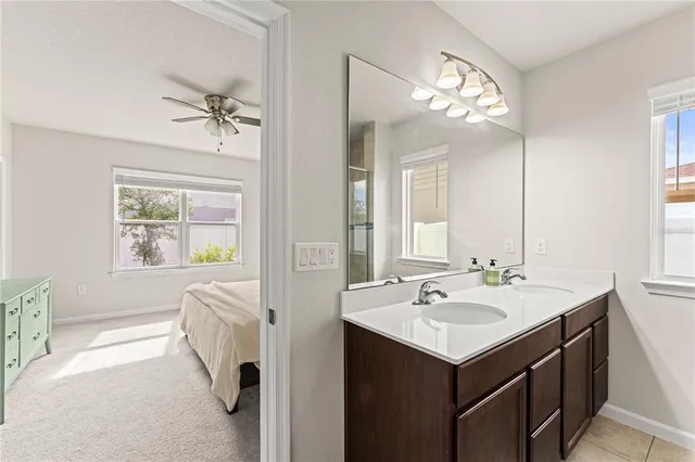 a spacious bathroom with a sink vanity tub and a mirror