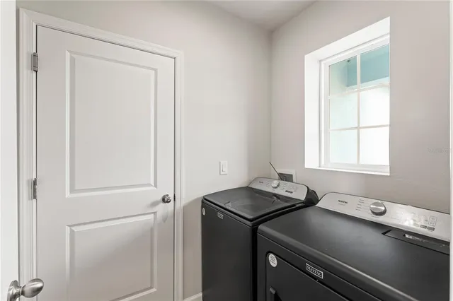 a room with a window and a table