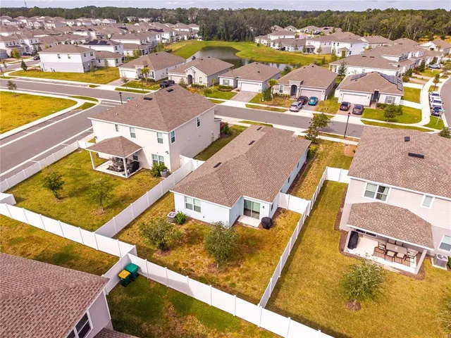 a aerial view of a house with a yard