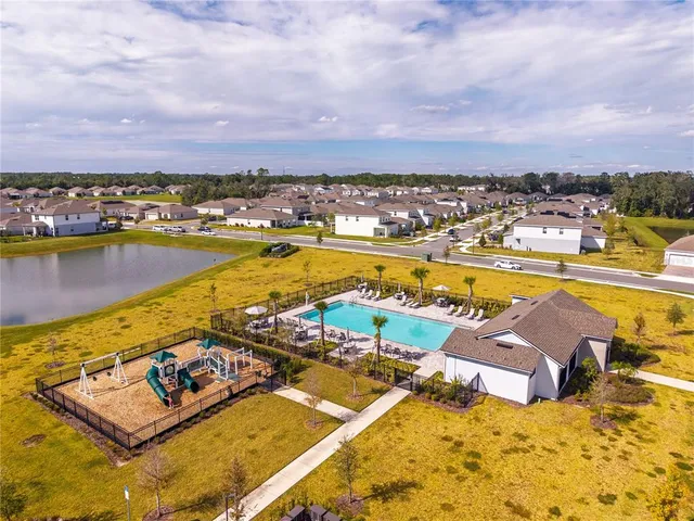 a view of swimming pool with outdoor seating