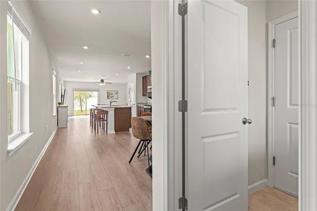 a dining room with furniture and wooden floor