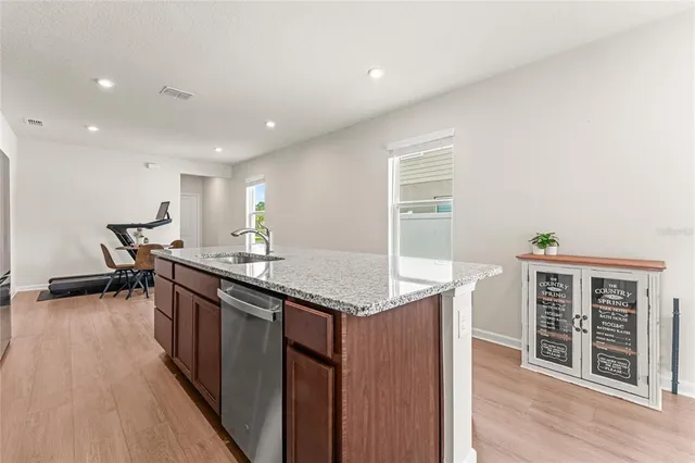 a kitchen with a sink and cabinets