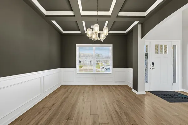a view of kitchen with wooden floor and window