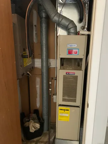 a bathroom with a mirror and a shower