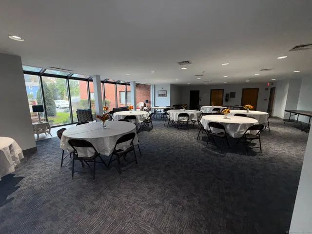 a living room with furniture a window and kitchen view
