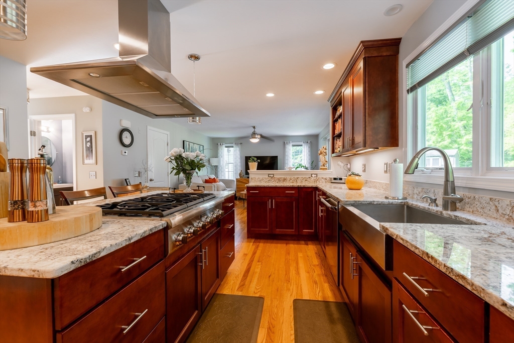 22 Duluth Street Worcester, MA 01604 - Photo 7 of 35 a kitchen with stainless steel appliances granite countertop a sink stove and cabinets