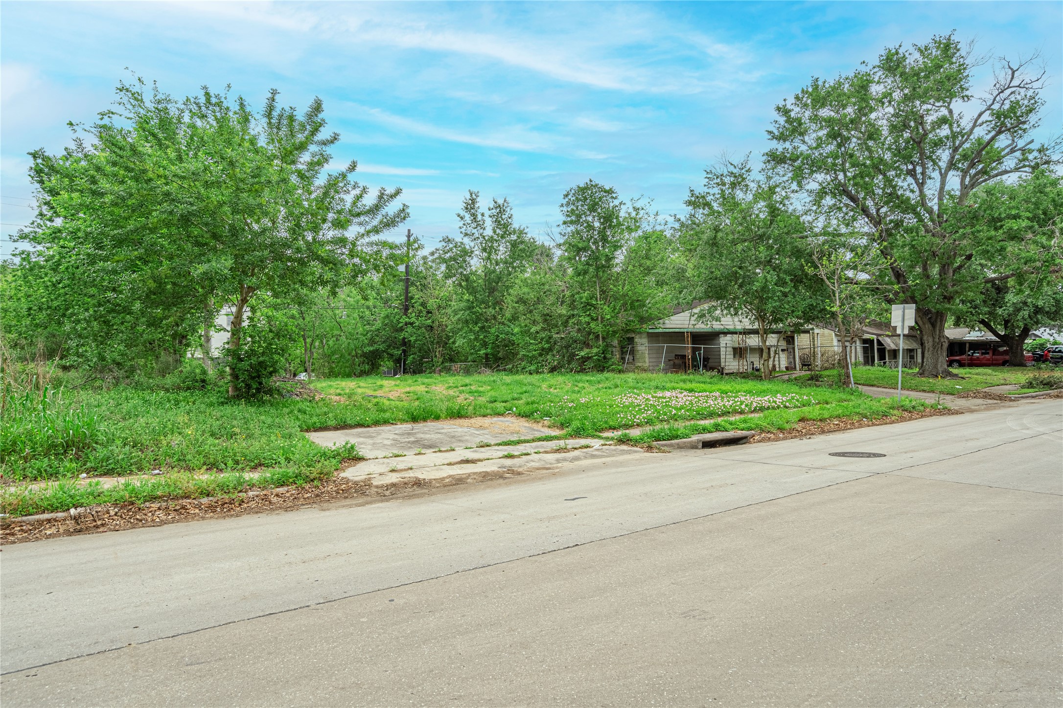6031 Beekman Road Houston, TX 77021 - Photo 2 of 6 a view of a house with a big yard and large trees