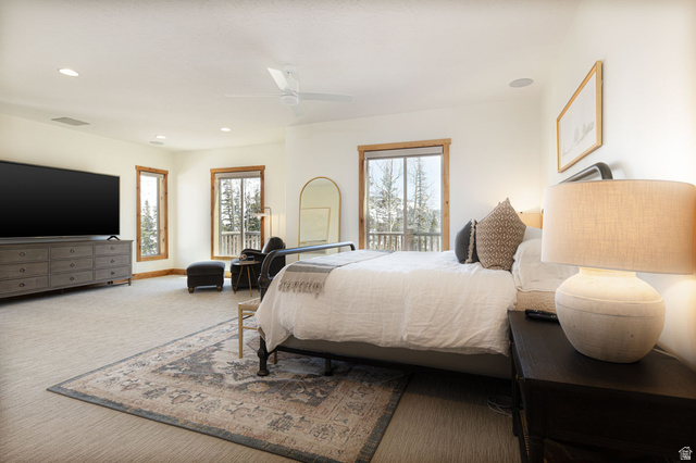382 Ridgeview Street, Unit 8 & 9 Brian Head, UT 84719 - Photo 15 of 52 Carpeted sleeping area featuring multiple windows with wood trim, a built-in ceiling fan, recessed lighting, and an integrated entertainment area