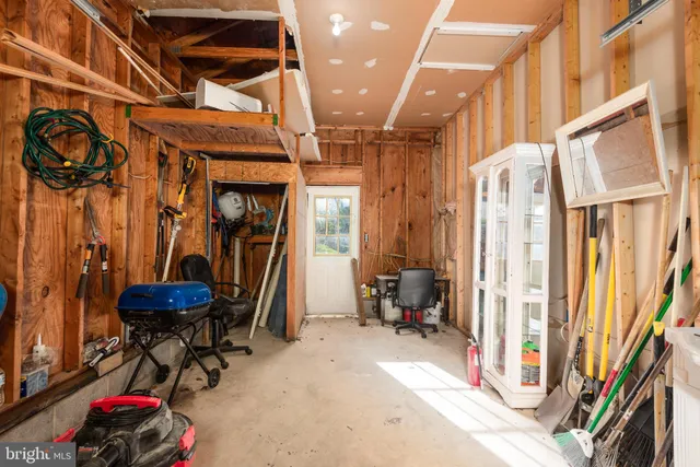 a house view with swimming pool in front of it