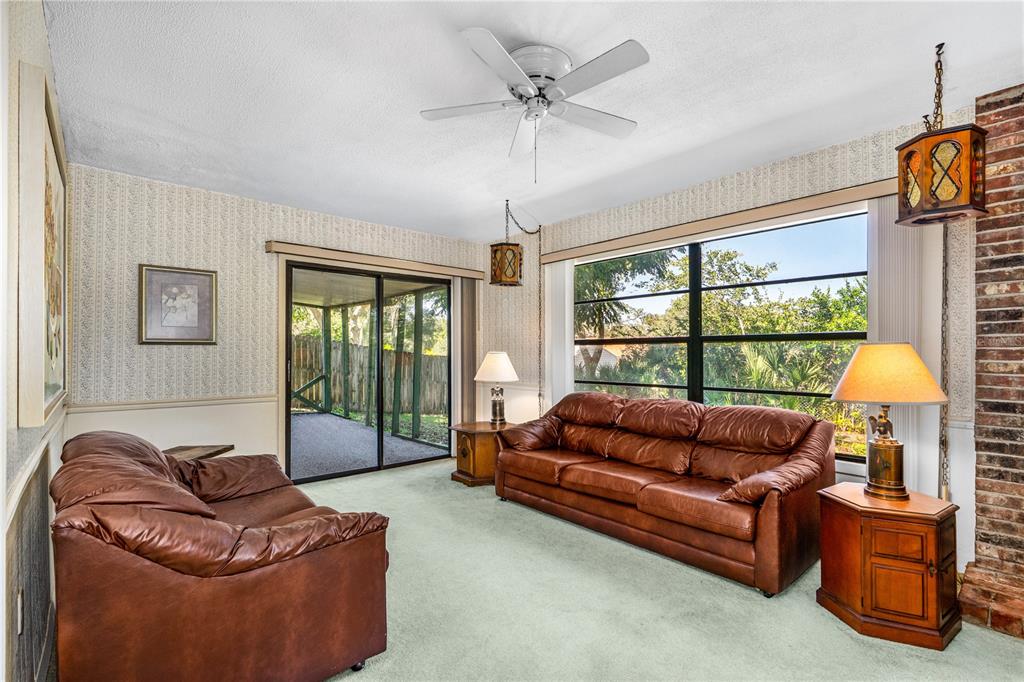 693 Reillys Road Port Orange, FL 32127 - Photo 14 of 31 a living room with furniture and a window