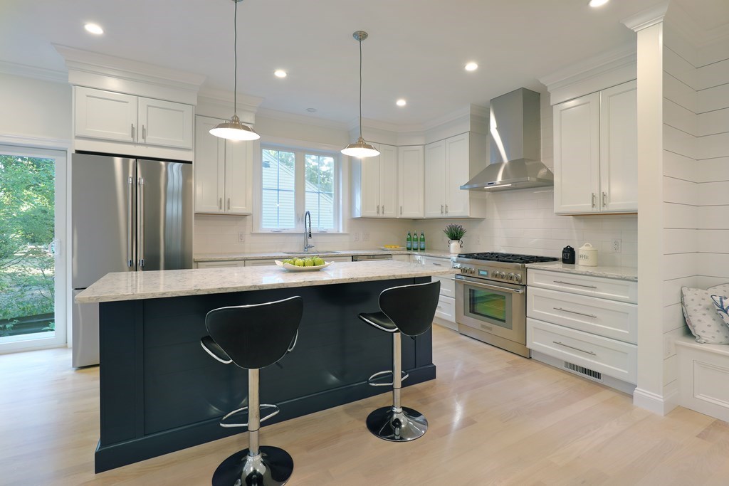a kitchen with a sink stainless steel appliances and cabinets