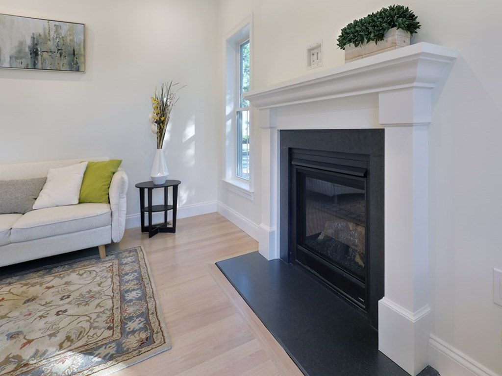 134 Spiers Road Newton, MA 02459 - Photo 13 of 38 a living room with furniture and a fireplace