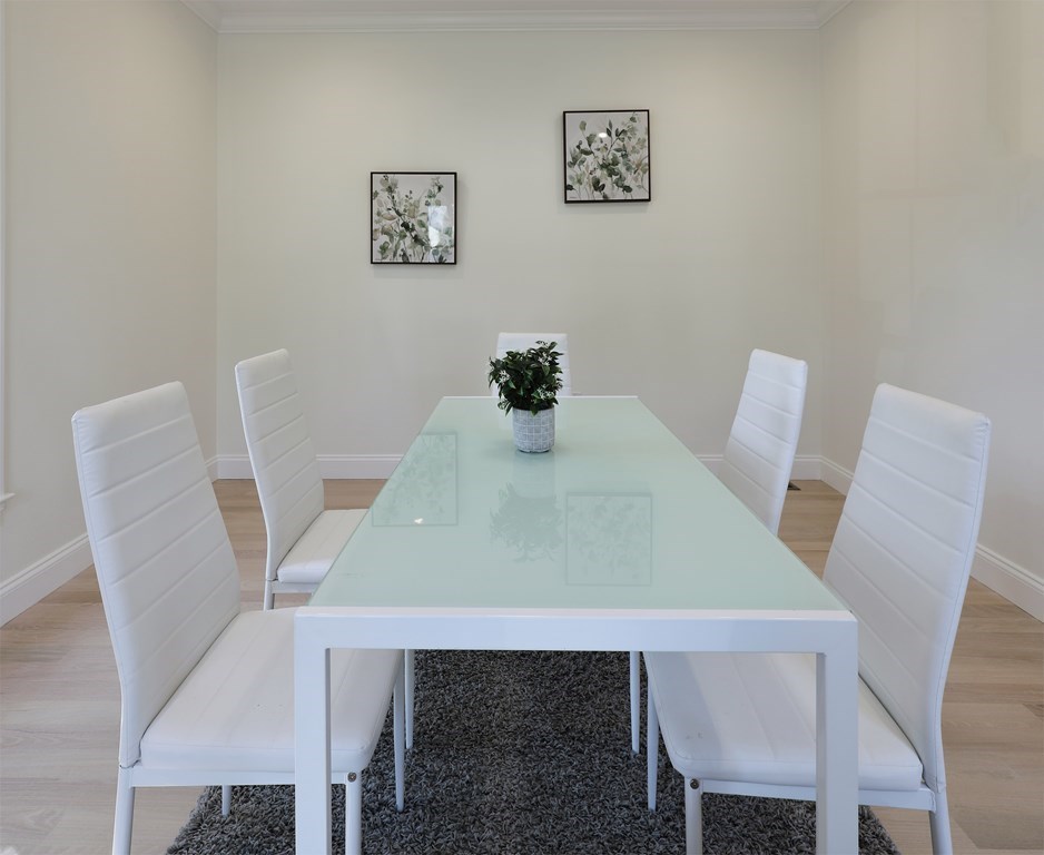 134 Spiers Road Newton, MA 02459 - Photo 16 of 38 a view of a dining room with furniture and wooden floor