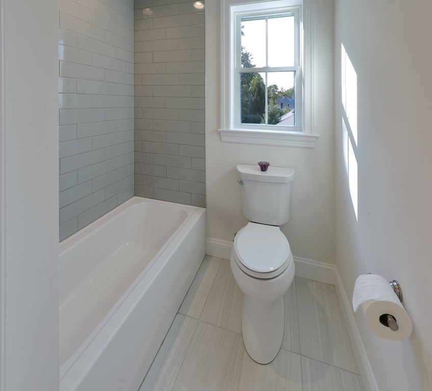 134 Spiers Road Newton, MA 02459 - Photo 18 of 38 a bathroom with a toilet and a tub