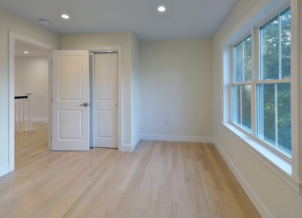 134 Spiers Road Newton, MA 02459 - Photo 21 of 38 a view of empty room with wooden floor and fan