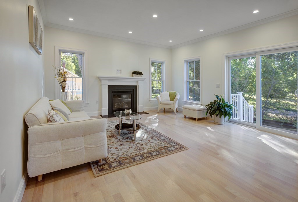 134 Spiers Road Newton, MA 02459 - Photo 23 of 38 a living room with furniture and a fireplace