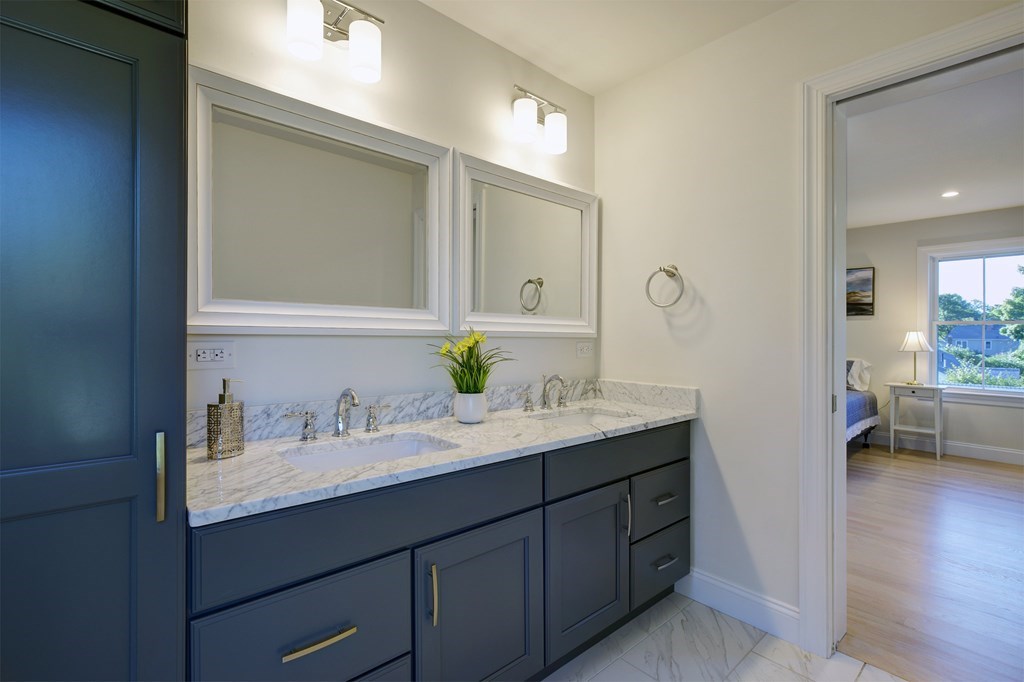 134 Spiers Road Newton, MA 02459 - Photo 29 of 38 a bathroom with a sink and a mirror