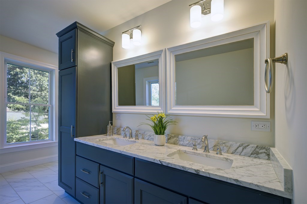 134 Spiers Road Newton, MA 02459 - Photo 30 of 38 a bathroom with a granite countertop sink and a mirror