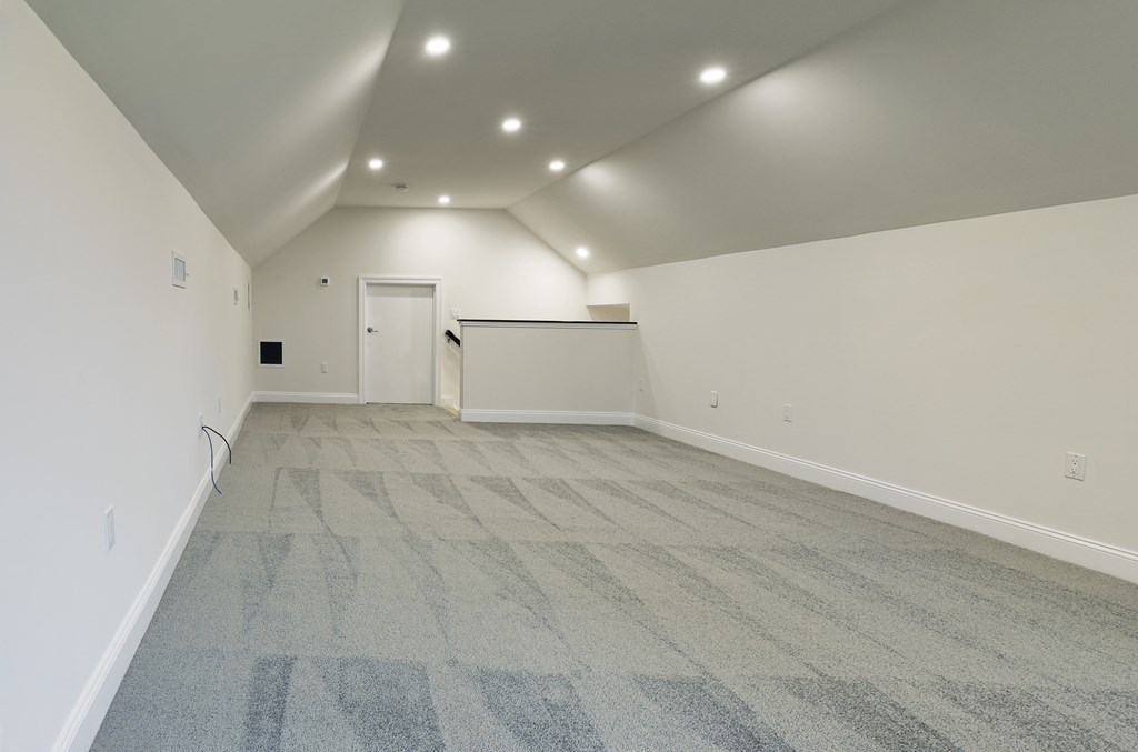 134 Spiers Road Newton, MA 02459 - Photo 34 of 38 an empty room with wooden floor and windows