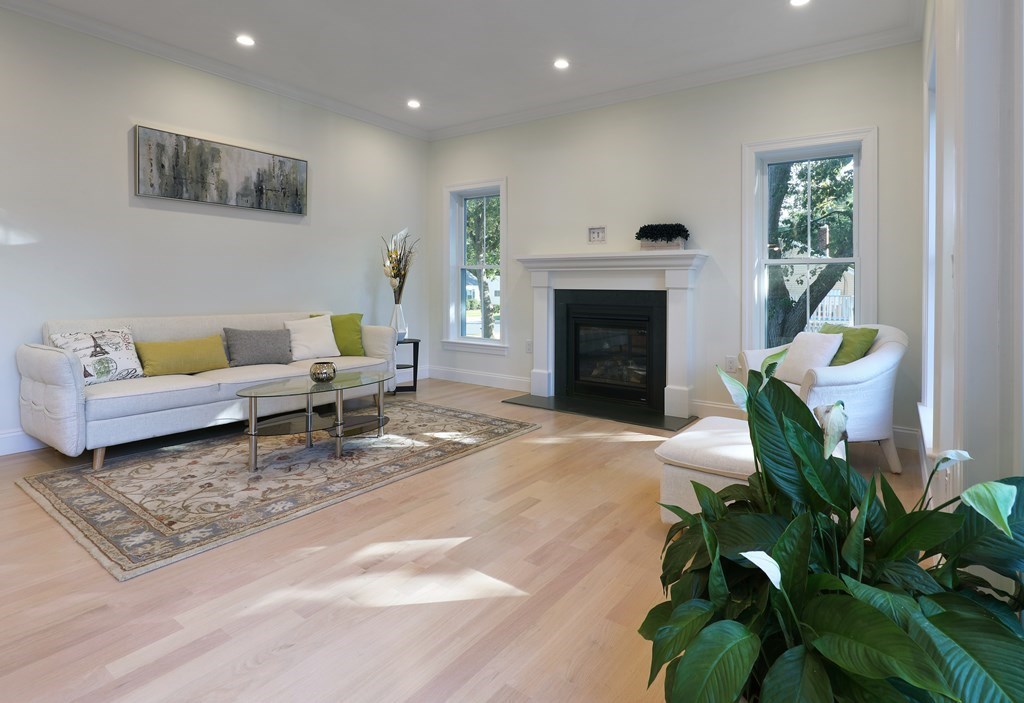 134 Spiers Road Newton, MA 02459 - Photo 4 of 38 a living room with furniture and a fireplace