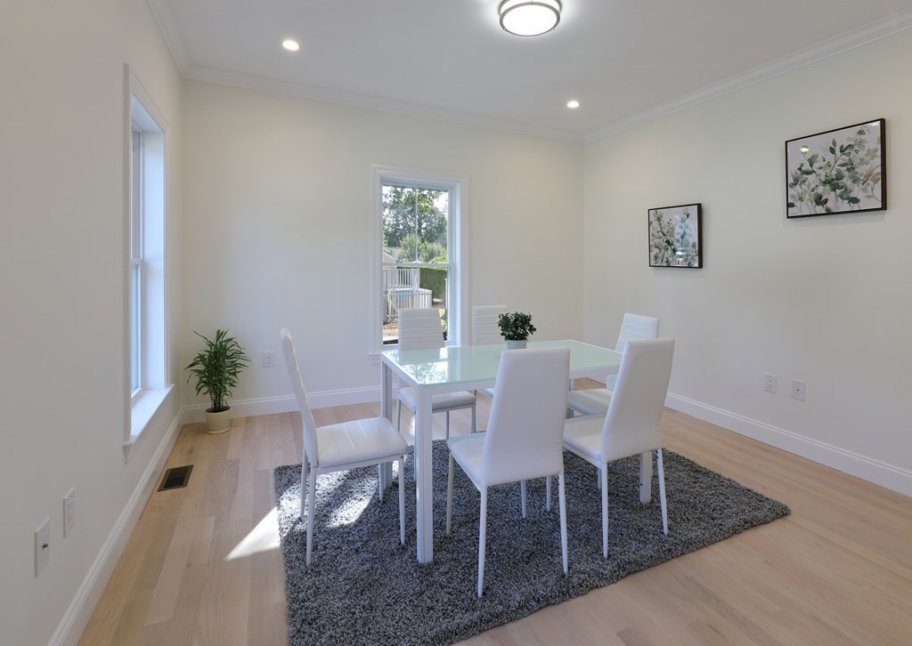 134 Spiers Road Newton, MA 02459 - Photo 5 of 38 a view of a dining room with furniture and a potted plant