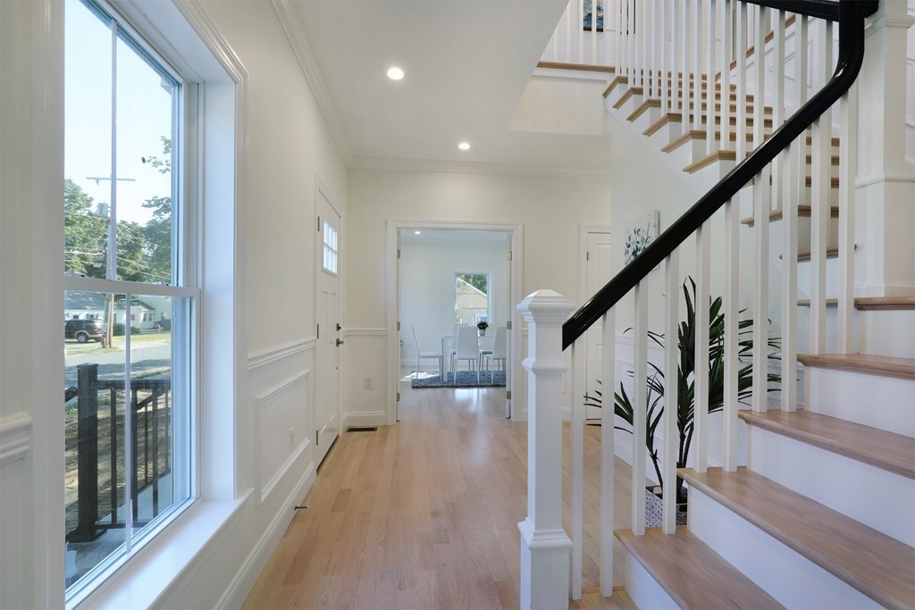 134 Spiers Road Newton, MA 02459 - Photo 8 of 38 a view of entryway with wooden floor and stairs